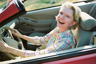 Elderly driving a car