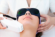 Woman having laser hair removal