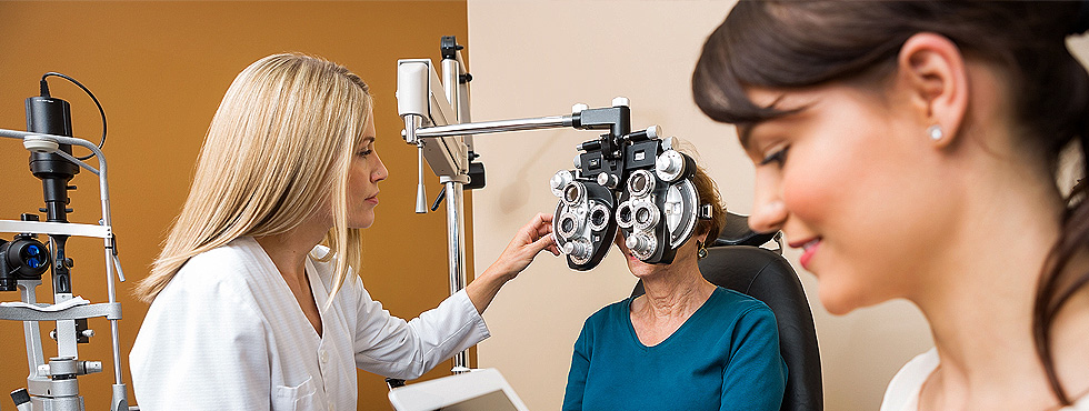 Senior woman having her eye check up