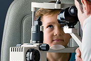 Young boy having his eye check up